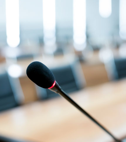microphone with conference table blurred in background